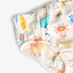 Vestito bianco con dettagli turchesi