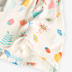 Vestito bianco con dettagli turchesi