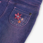 Pantaloni jeans a zampa fiori applicati viola