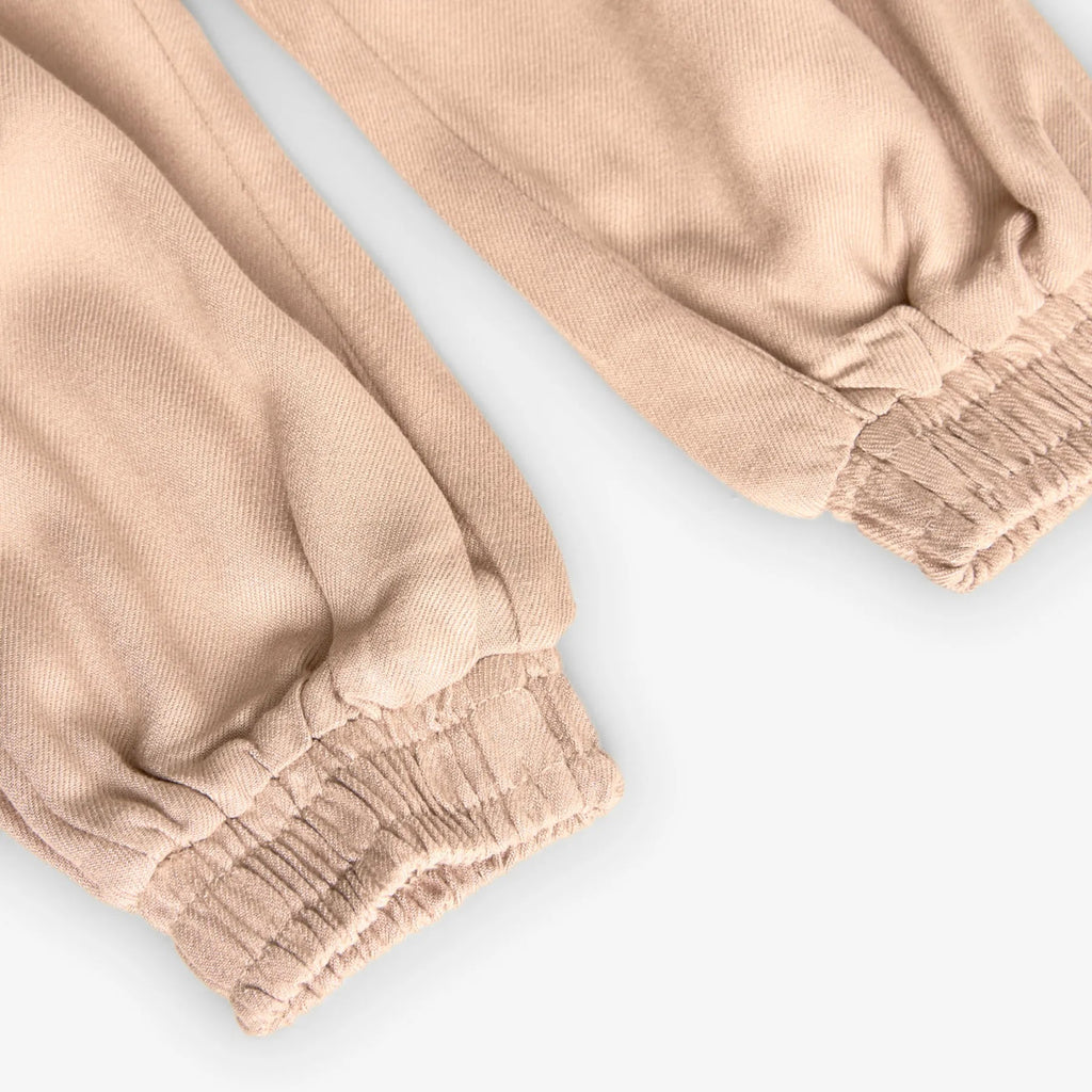 Pantaloni vita a sacchetto tasconi crema
