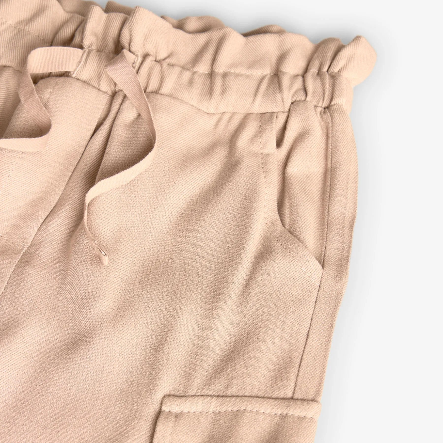Pantaloni vita a sacchetto tasconi crema