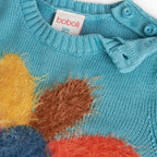 Maglione con fiore fondo turchese