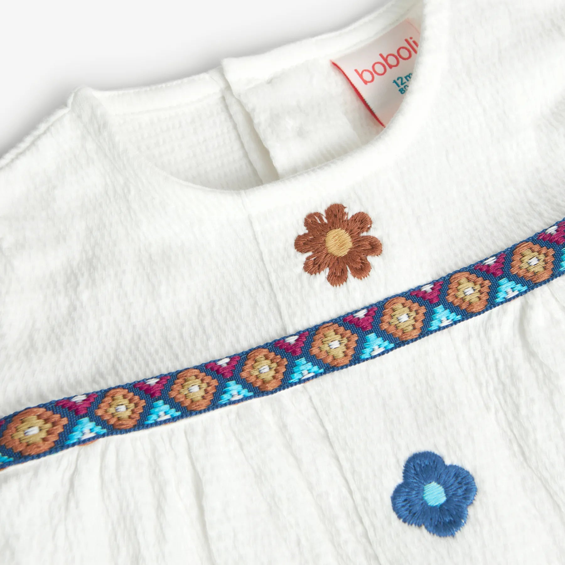 Maglietta jersey con fiori applicati