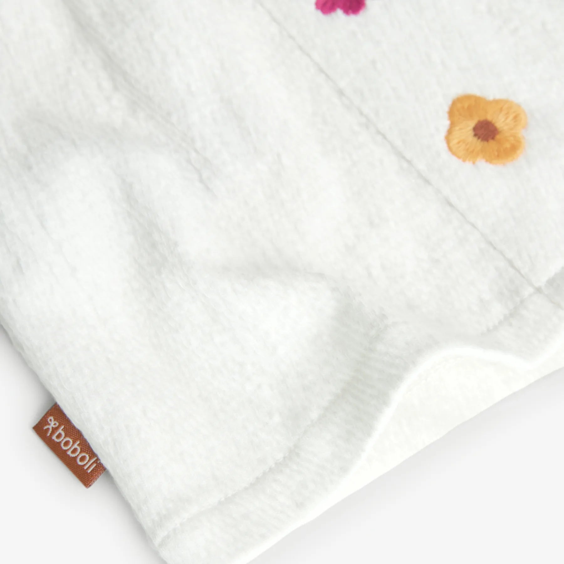 Maglietta jersey con fiori applicati