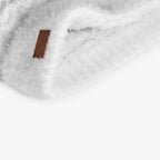 Cappello trecce e pompon bianco bambina