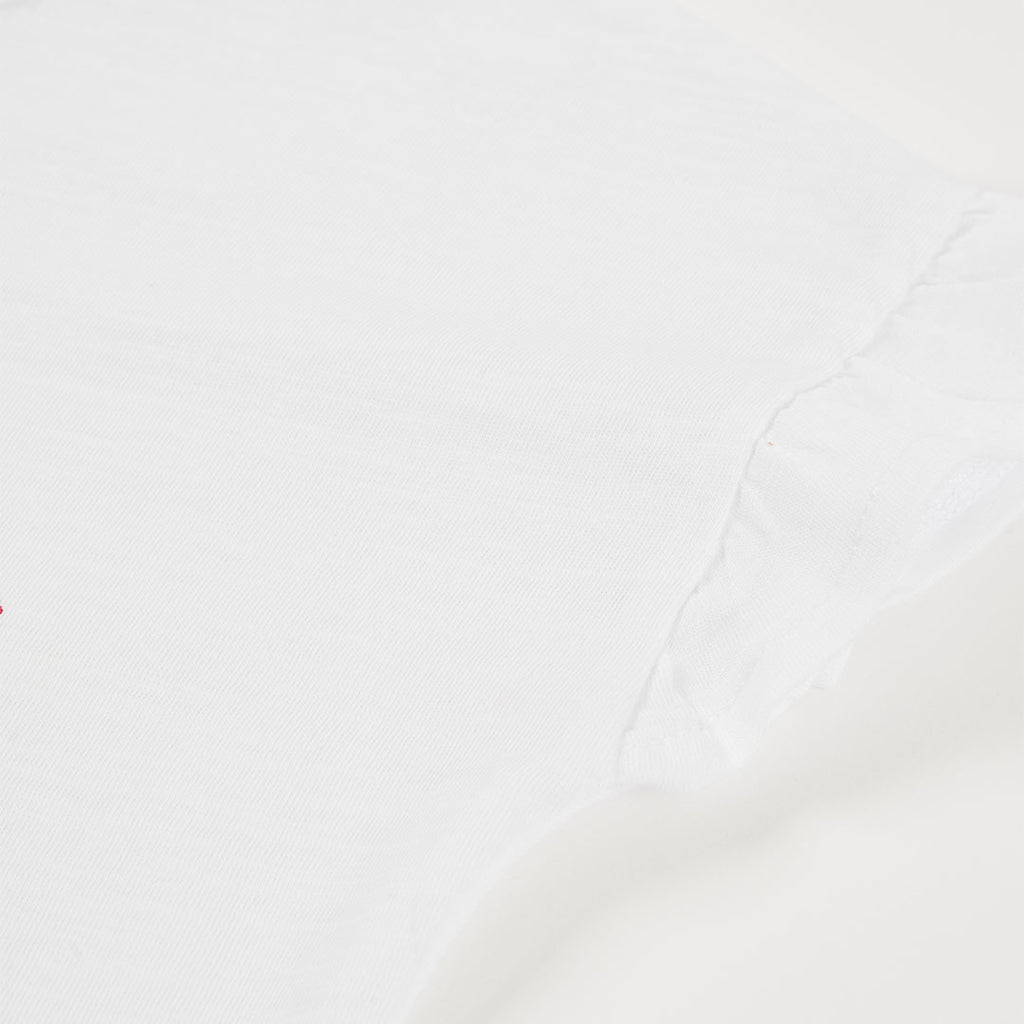 T-shirt manica corta con volano e applicazione